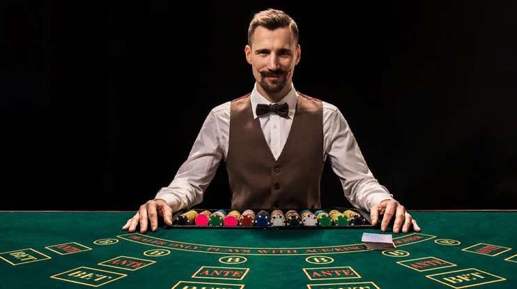 Live casino dealer at blackjack table